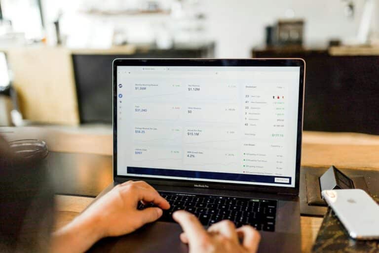 person using MacBook pro outsourced accounting