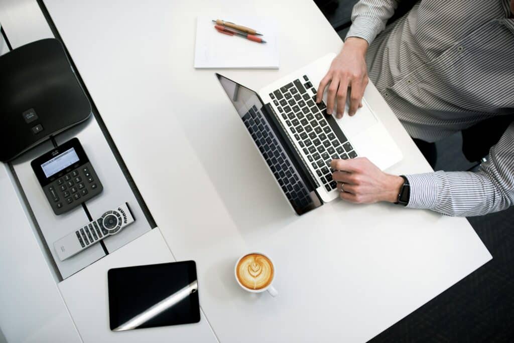 Master Your Finances with the Best Tax Planner for Every Need 5 person using laptop on white wooden table
