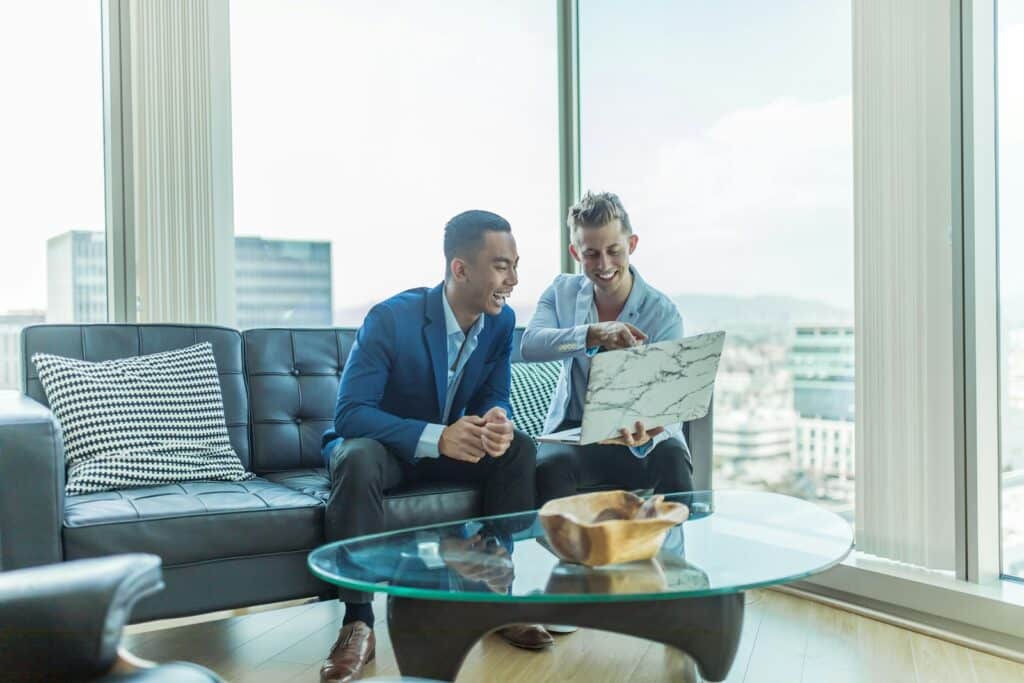 The Benefits of Hiring a CFO Outsourced for Your Business Growth 1 two men in suit sitting on sofa